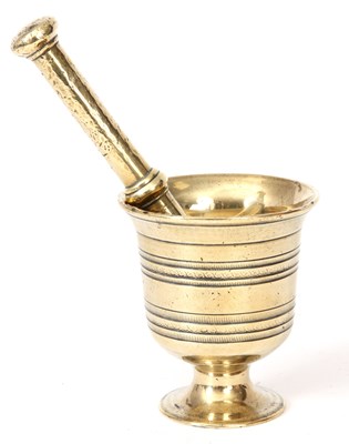 Lot 331 - AN 18TH CENTURY URN SHAPED CAST BRASS MORTAR...