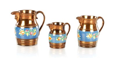 Lot 1683 - A GRADUATED SET OF THREE 19TH CENTURY COPPER LUSTRE WARE MUGS