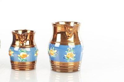 Lot 41 - A GRADUATED SET OF THREE 19TH CENTURY COPPER LUSTRE WARE MUGS