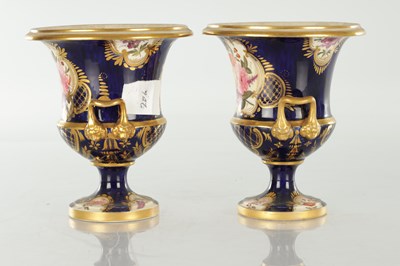 Lot 18 - A PAIR OF ROYAL DERBY CERAMIC URN SHAPED VASES