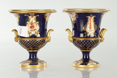 Lot 18 - A PAIR OF ROYAL DERBY CERAMIC URN SHAPED VASES