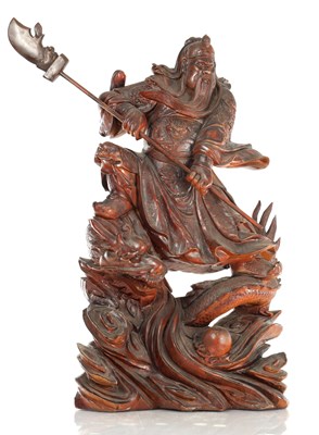 Lot 132 - A LATE 19TH CENTURY CARVED HARDWOOD FIGURE OF A WARRIOR STANDING ON A DRAGON