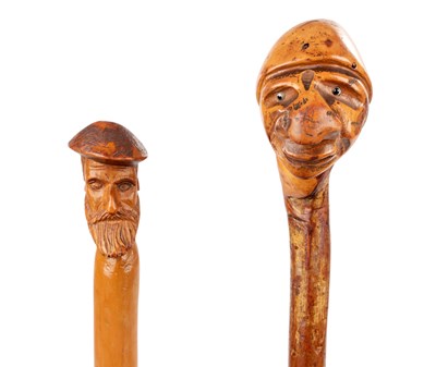 Lot 1067 - TWO LATE 19TH CENTURY FOLK ART CARVED HEAD WALKING STICKS