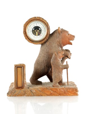Lot 962 - AN EARLY 20TH CENTURY BLACK FOREST CARVED LINDEN WOOD BEAR DESK BAROMETER