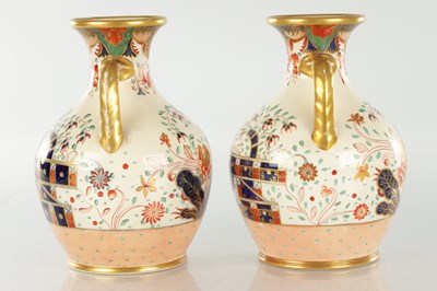 Lot 40 - A PAIR OF 19TH CENTURY COPELAND SPODE IMARI PATTERN CERAMIC ENGLISH BOTTLE VASES