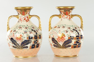 Lot 40 - A PAIR OF 19TH CENTURY COPELAND SPODE IMARI PATTERN CERAMIC ENGLISH BOTTLE VASES