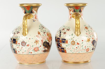 Lot 40 - A PAIR OF 19TH CENTURY COPELAND SPODE IMARI PATTERN CERAMIC ENGLISH BOTTLE VASES