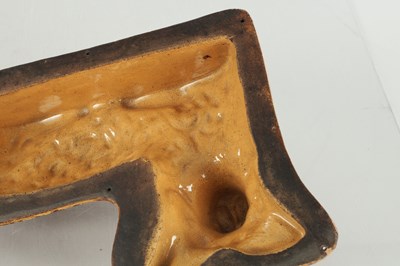 Lot 89 - AN UNUSUAL 19TH CENTURY YORKSHIRE SLIPWARE MOULD FORMED AS A COW