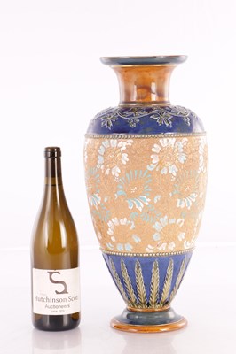 Lot 19 - A DOULTON LAMBETH STONEWARE TAPERED SHOULDERED VASE WITH SLENDER NECK AND FLARED RIM