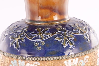 Lot 19 - A DOULTON LAMBETH STONEWARE TAPERED SHOULDERED VASE WITH SLENDER NECK AND FLARED RIM