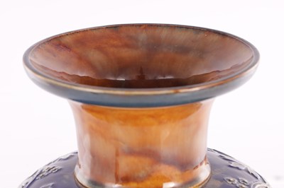 Lot 19 - A DOULTON LAMBETH STONEWARE TAPERED SHOULDERED VASE WITH SLENDER NECK AND FLARED RIM