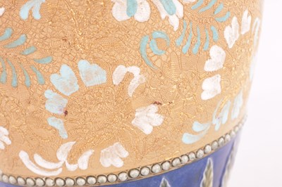 Lot 19 - A DOULTON LAMBETH STONEWARE TAPERED SHOULDERED VASE WITH SLENDER NECK AND FLARED RIM