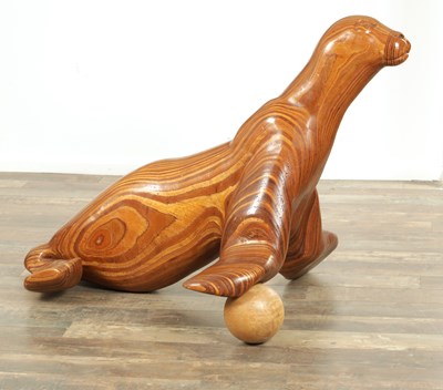 Lot 904 - A STYLISH PLYWOOD SCULPTURE OF A SEA LION WITH A BALL