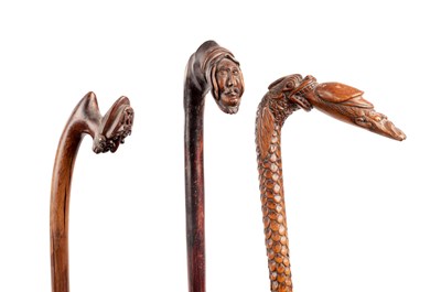 Lot 1068 - THREE 19TH CENTURY FOLK ART CARVED WOOD WALKING STICKS
