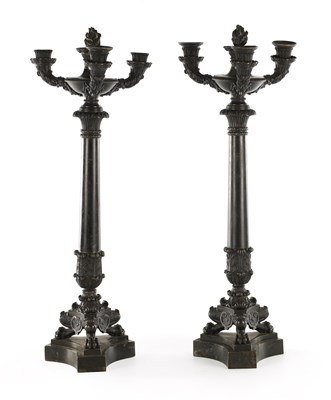 Lot 520 - A PAIR OF REGENCY BRONZE THREE BRANCH CANDELABRA
