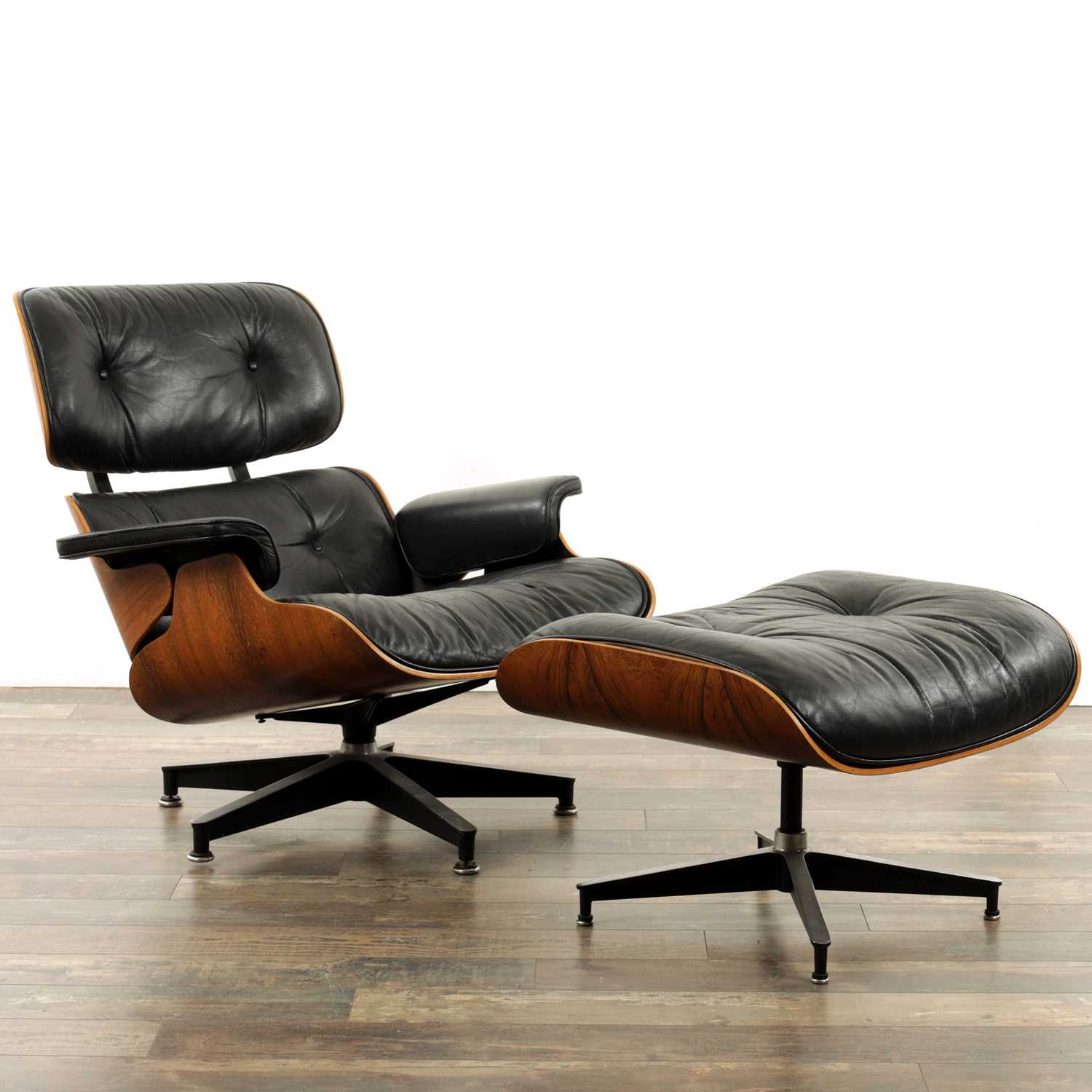 Lot 1269 - CHARLES AND RAY EAMES. A 1970's LEATHER UPHOLSTERED LOUNGE CHAIR AND OTTOMAN