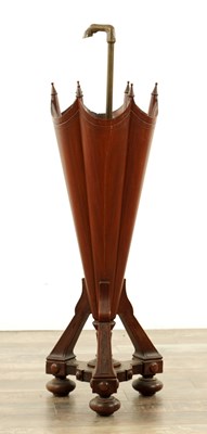 Lot 1309 - A LATE 19TH CENTURY WALNUT AND BRASS UMBRELLA STAND