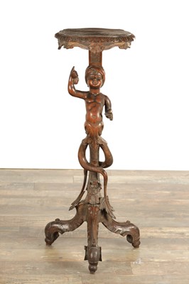 Lot 1595 - A 19TH CENTURY ITALIAN CARVED WALNUT FIGURAL JARDINIERE STAND