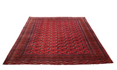 Lot 620 - A HAND-KNOTTED PERSIAN TORKAMAN CARPET