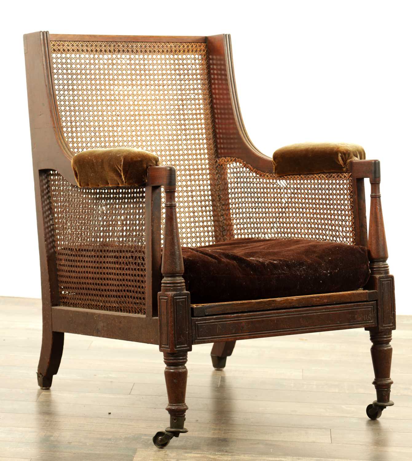 Lot 1464 - A REGENCY MAHOGANY LIBRARY BERGERE CHAIR
