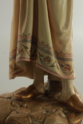 Lot 44 - A PAIR OF LATE 19TH CENTURY ROYAL WORCESTER PORCELAIN FIGURES OF WATER CARRIERS