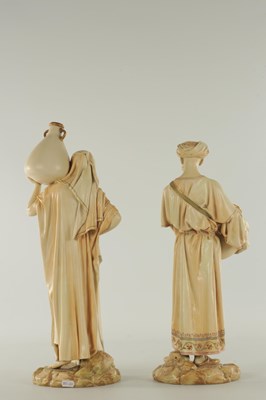 Lot 44 - A PAIR OF LATE 19TH CENTURY ROYAL WORCESTER PORCELAIN FIGURES OF WATER CARRIERS