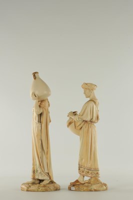 Lot 44 - A PAIR OF LATE 19TH CENTURY ROYAL WORCESTER PORCELAIN FIGURES OF WATER CARRIERS