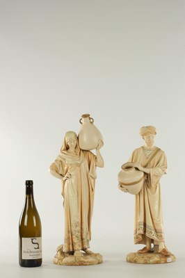 Lot 44 - A PAIR OF LATE 19TH CENTURY ROYAL WORCESTER PORCELAIN FIGURES OF WATER CARRIERS