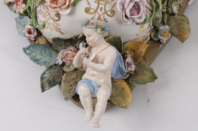 Lot 35 - A PAIR OF MEISSEN STYLE PORCELAIN HANGING MIRRORS