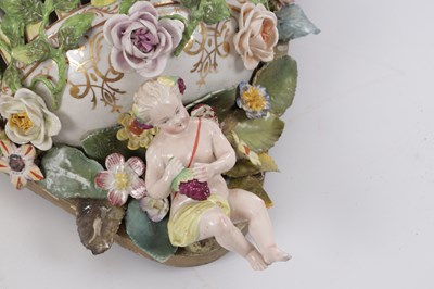Lot 35 - A PAIR OF MEISSEN STYLE PORCELAIN HANGING MIRRORS