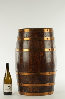 Lot 597 - AN EARLY 20TH CENTURY COOPERED BRASS MOUNTED OAK BARREL STICK STAND