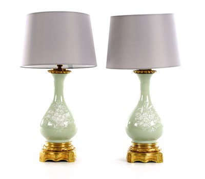Lot 13 - A PAIR OF CELADON PORCELAIN AND ORMOLU LAMPS