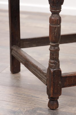 Lot 1580 - A 17TH CENTURY OAK FRAMED LEATHER UPHOLSTERED ARMCHAIR