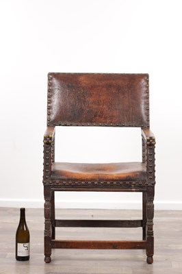 Lot 1580 - A 17TH CENTURY OAK FRAMED LEATHER UPHOLSTERED ARMCHAIR