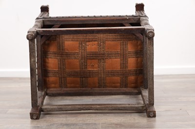 Lot 1580 - A 17TH CENTURY OAK FRAMED LEATHER UPHOLSTERED ARMCHAIR