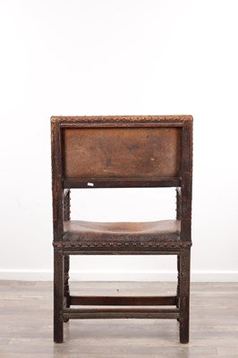 Lot 1580 - A 17TH CENTURY OAK FRAMED LEATHER UPHOLSTERED ARMCHAIR