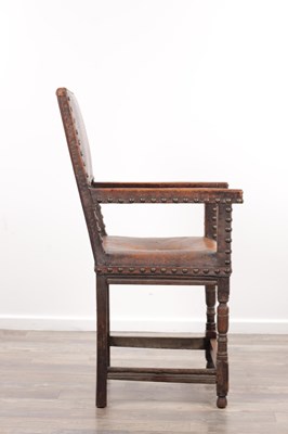 Lot 1580 - A 17TH CENTURY OAK FRAMED LEATHER UPHOLSTERED ARMCHAIR