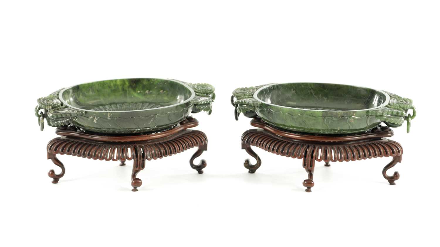 Lot 138 - A PAIR OF LATE QING DYNASTY CHINESE JADE DISHES ON STANDS
