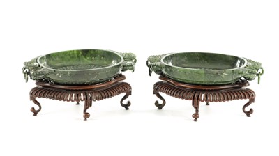 Lot 138 - A PAIR OF LATE QING DYNASTY CHINESE JADE DISHES ON STANDS