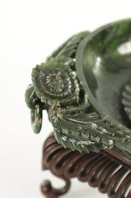 Lot 138 - A PAIR OF LATE QING DYNASTY CHINESE JADE DISHES ON STANDS