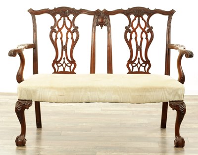Lot 129 - A 19TH CENTURY CHIPPENDALE STYLE MAHOGANY TWO SEATER SETTEE