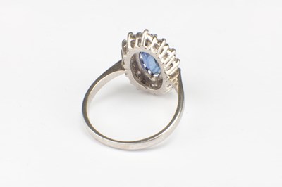 Lot 312 - AN 18CT WHITE GOLD SAPPHIRE AND DIAMOND RING