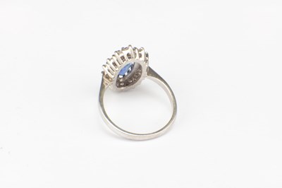 Lot 312 - AN 18CT WHITE GOLD SAPPHIRE AND DIAMOND RING