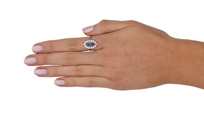 Lot 312 - AN 18CT WHITE GOLD SAPPHIRE AND DIAMOND RING