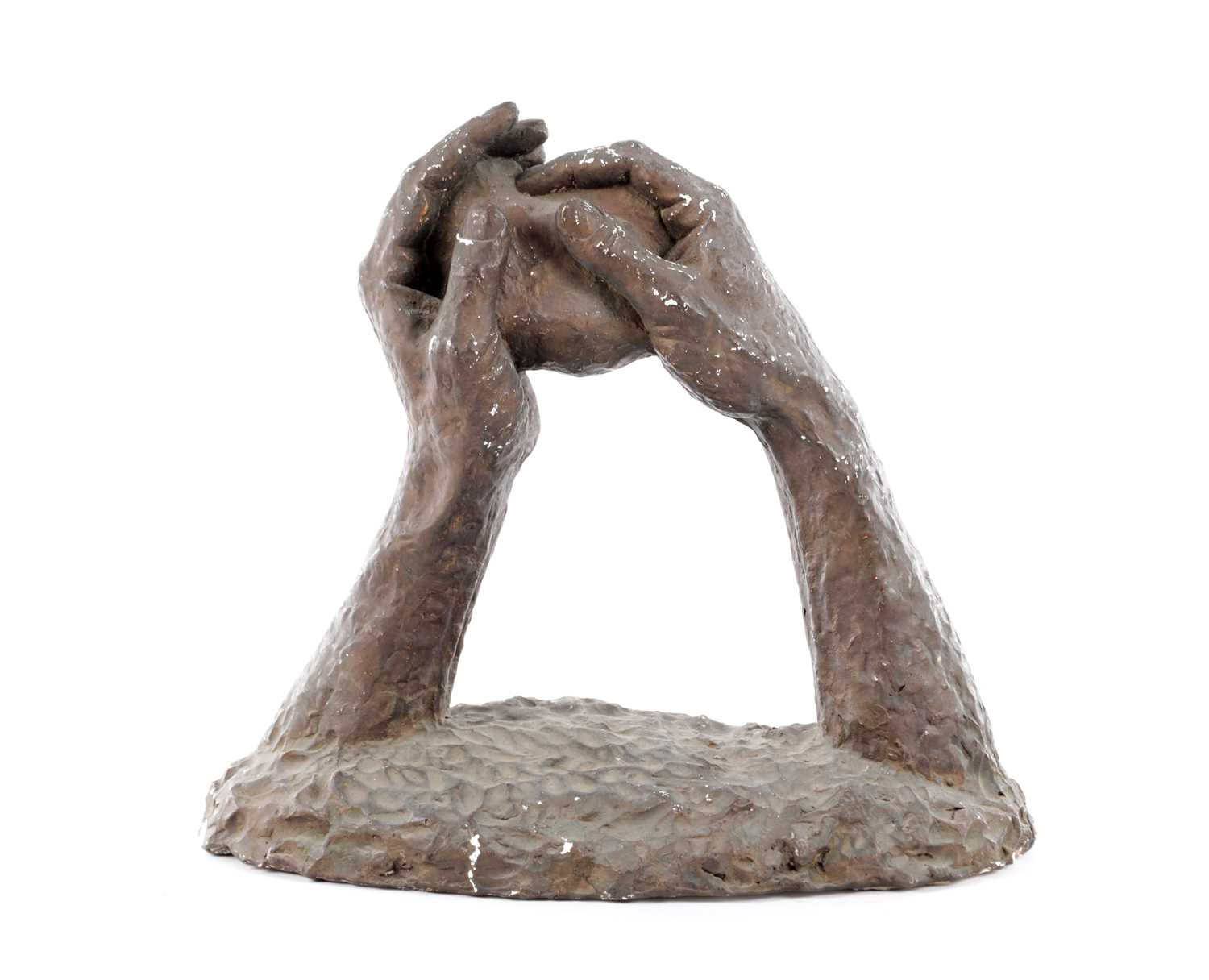 Lot A 20TH CENTURY PLASTER SCULPTURE OF TWO HANDS HOLDING A ROCK