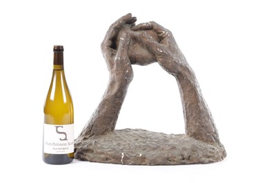 Lot A 20TH CENTURY PLASTER SCULPTURE OF TWO HANDS HOLDING A ROCK