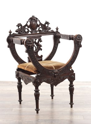 Lot A 19TH CENTURY CARVED WALNUT X FRAMED ARMCHAIR WITH LION MASKS AND GRIFFIN CRESTING