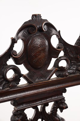 Lot A 19TH CENTURY CARVED WALNUT X FRAMED ARMCHAIR WITH LION MASKS AND GRIFFIN CRESTING