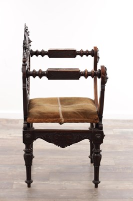 Lot A 19TH CENTURY CARVED WALNUT X FRAMED ARMCHAIR WITH LION MASKS AND GRIFFIN CRESTING