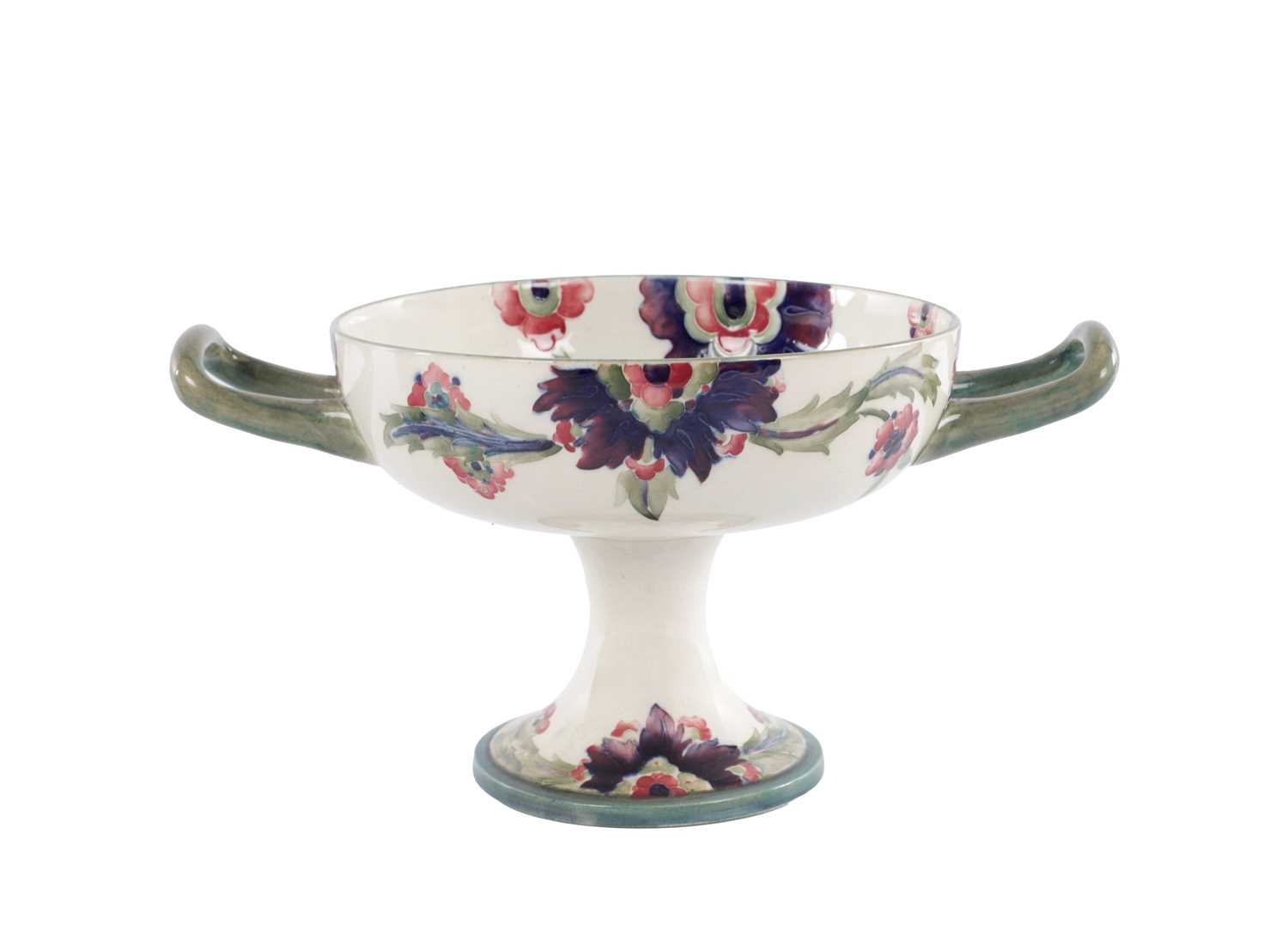 Lot 22 - AN EARLY 20TH CENTURY MOORCROFT TWO HANDLED FOOTED BOWL
